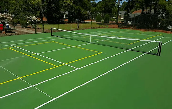 Tennis court with pickleball courts on it