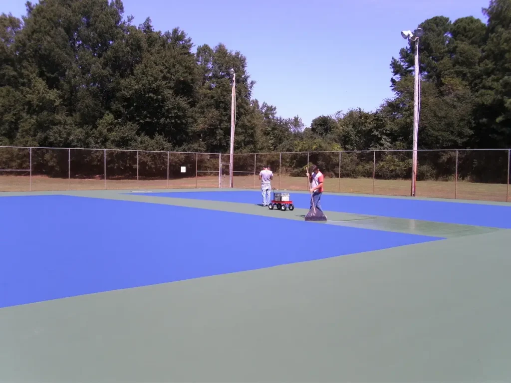 finished outdoor tennis court resurfacing project with blue and green court colors